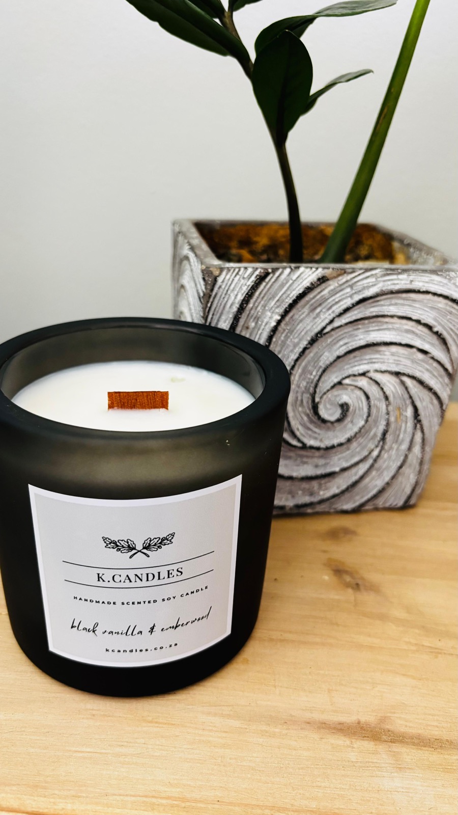 K.Candles handcrafted candles on a styled surface